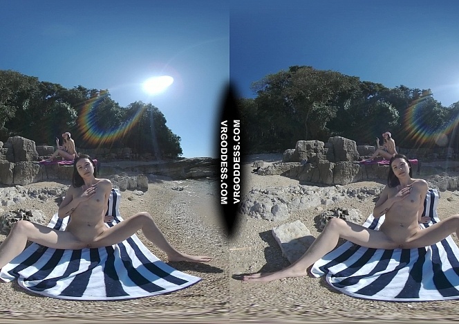 051724_matty_glass_dildo_masturbating_nude_beach_with_josie_sunbathing_nude_background