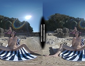 051724_matty_glass_dildo_masturbating_nude_beach_with_josie_sunbathing_nude_background